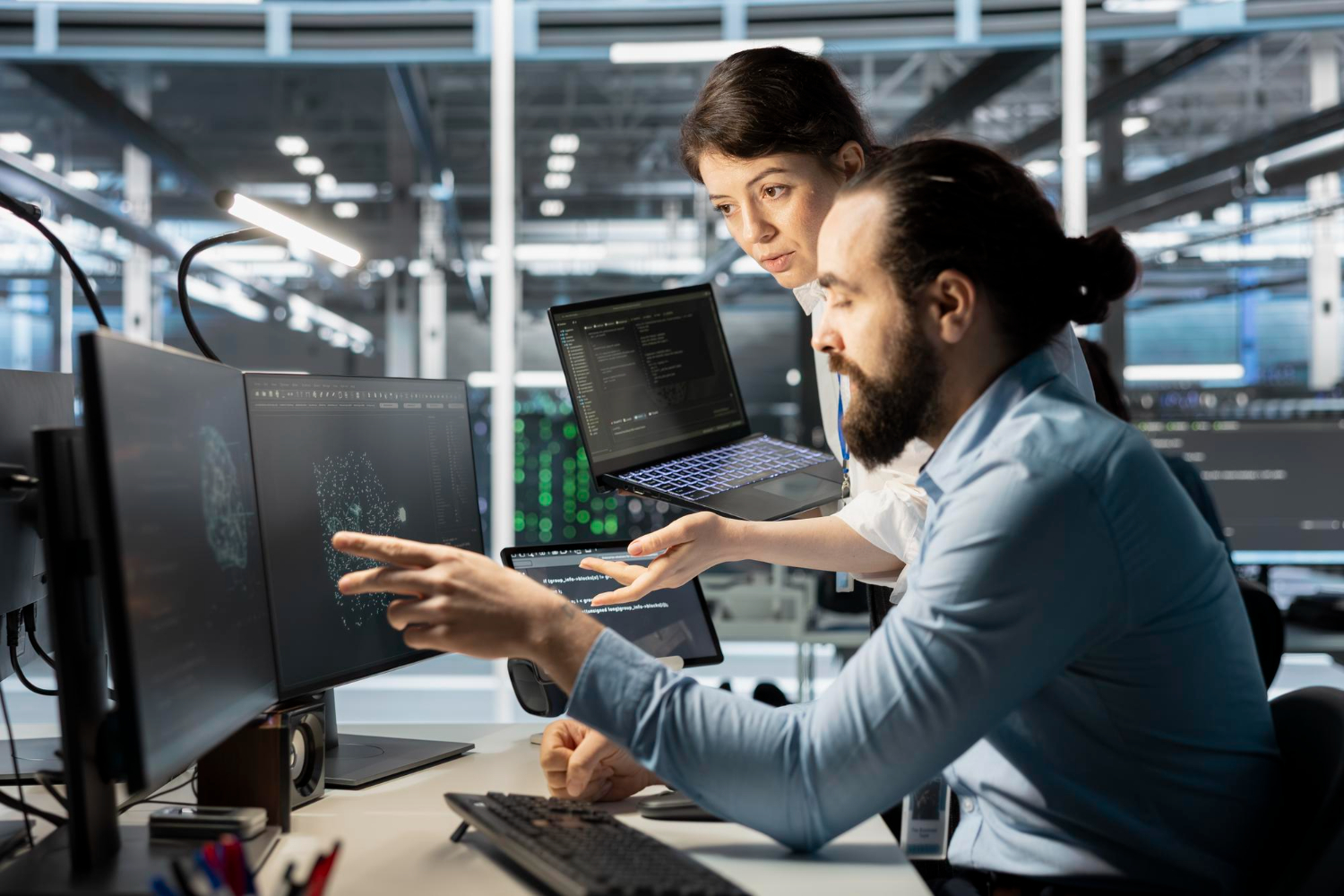 Exctel engineers collaborating on digital systems in a modern control room